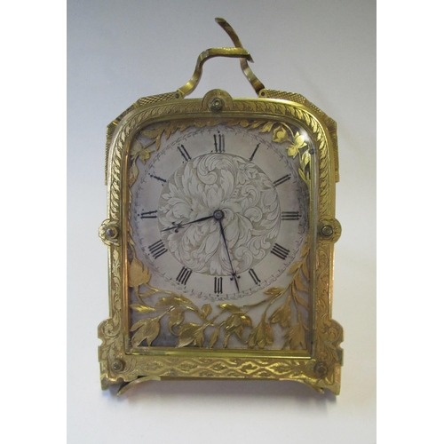 663 - An early Victorian engraved brass easel clock