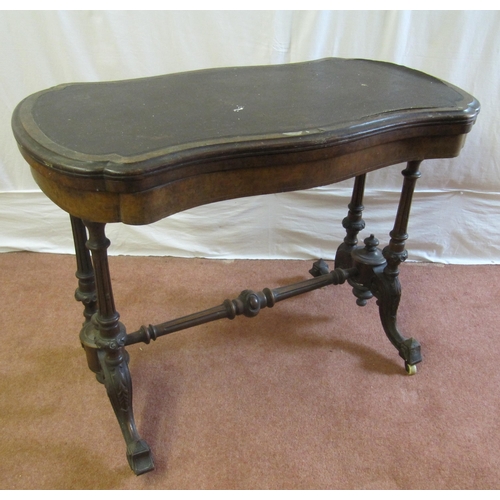 756 - A Victorian walnut turnover games table