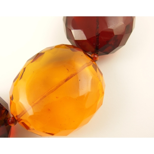 100 - Item 5. A very large orange and cherry amber coloured statement necklace