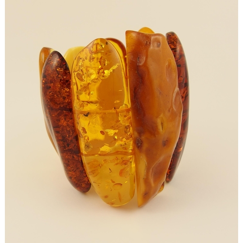 101 - Item 6. A very large yellow and orange amber coloured statement bracelet