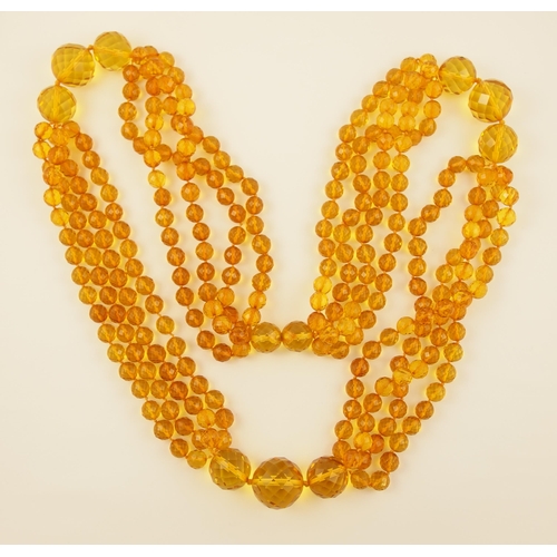 102 - Item 7. A very long diamond yellow amber coloured festoon statement necklace