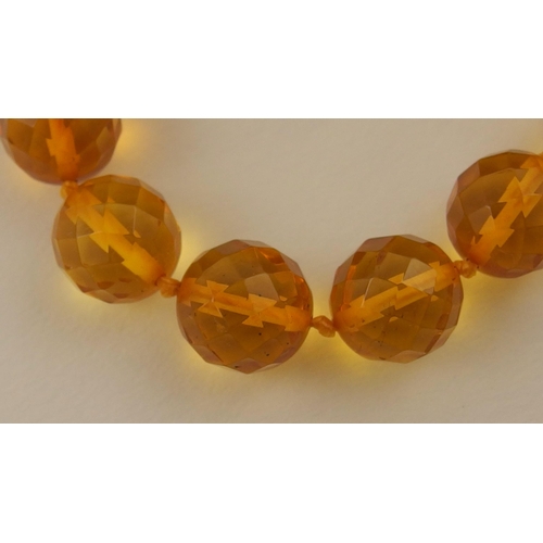 102 - Item 7. A very long diamond yellow amber coloured festoon statement necklace