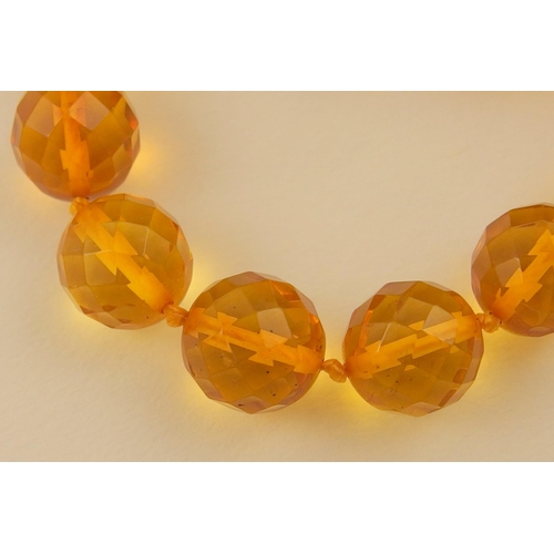 102 - Item 7. A very long diamond yellow amber coloured festoon statement necklace