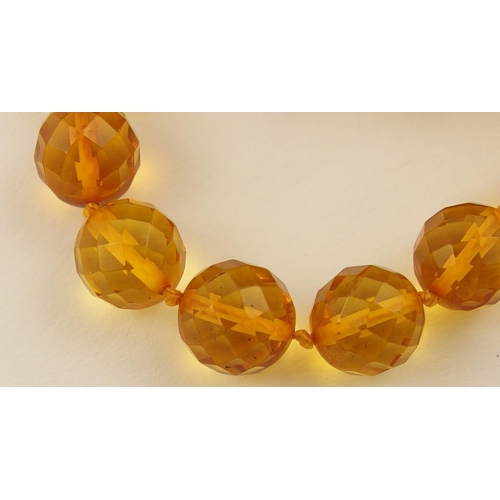 102 - Item 7. A very long diamond yellow amber coloured festoon statement necklace