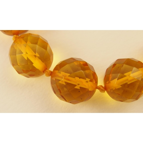 102 - Item 7. A very long diamond yellow amber coloured festoon statement necklace