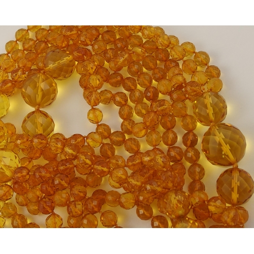 102 - Item 7. A very long diamond yellow amber coloured festoon statement necklace