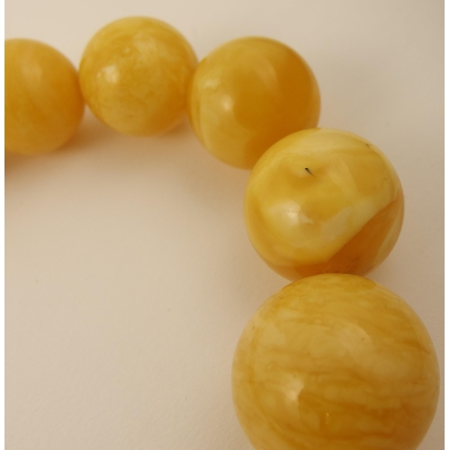 103 - Item 8. A large royal amber coloured necklace