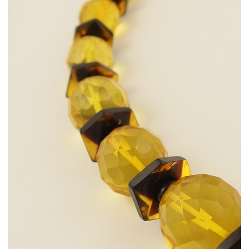 105 - Item 10. A yellow and brown amber coloured statement necklace