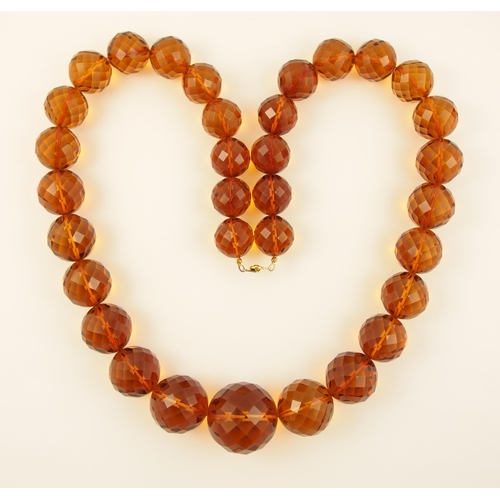 106 - Item 11. An orange diamond amber coloured statement necklace