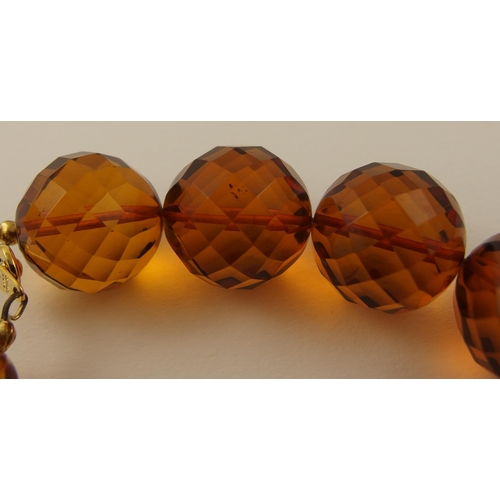 106 - Item 11. An orange diamond amber coloured statement necklace