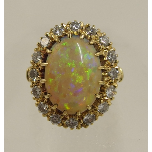 119 - An 18ct yellow gold opal and diamond ring