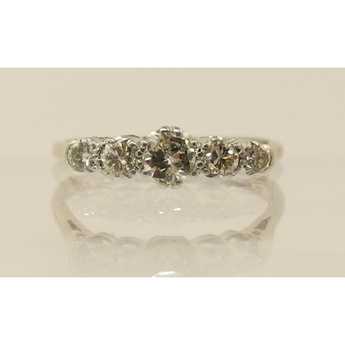 160 - An 18ct and platinum five stone diamond ring