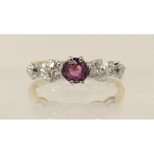 165 - A yellow metal diamond and pink gem ring