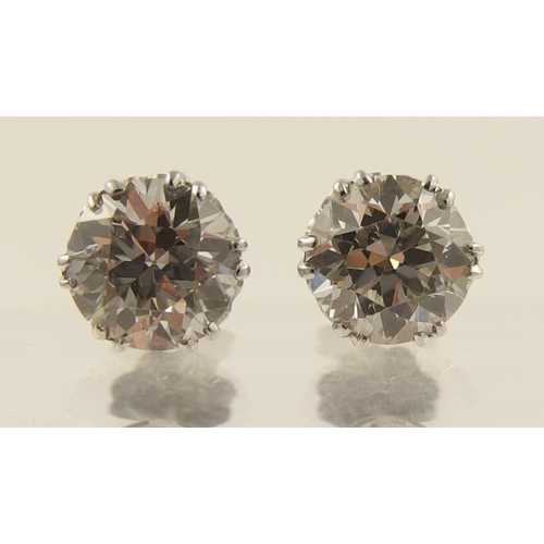 29 - A pair of substantial diamond stud earrings