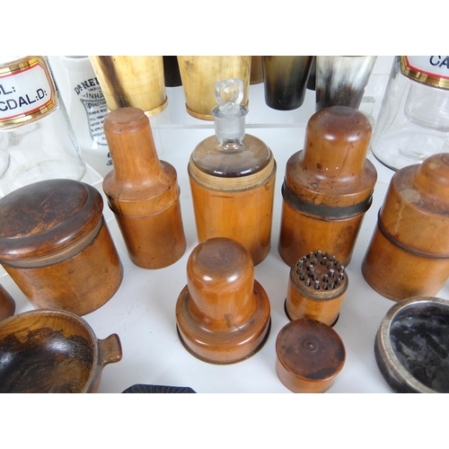 311 - A group of treen medicine bottle containers