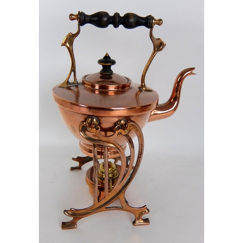 317 - An Arts and Crafts copper tea kettle on stand