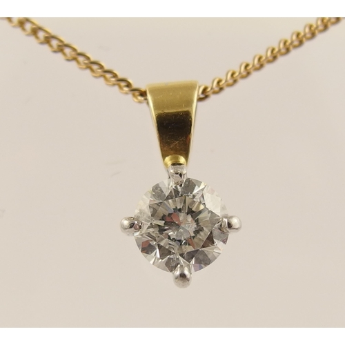 63 - An 18ct solitaire diamond pendant