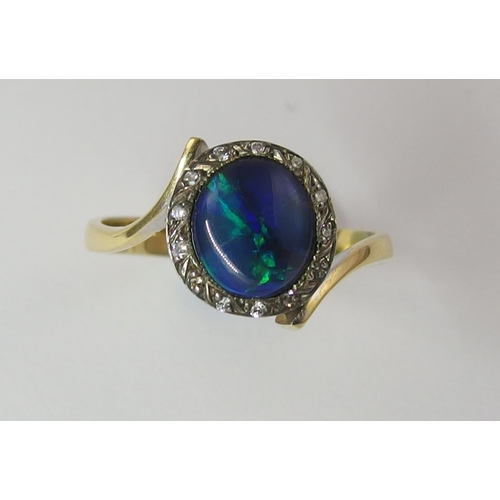 65 - An 18ct black opal and diamond ring