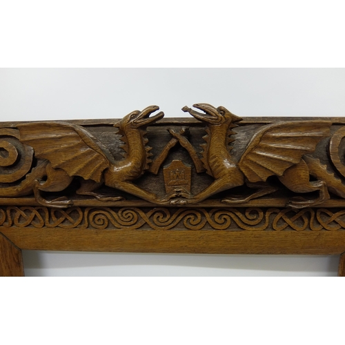 702 - Manner of ALEXANDER RITCHIE an elaborately carved oak picture frame