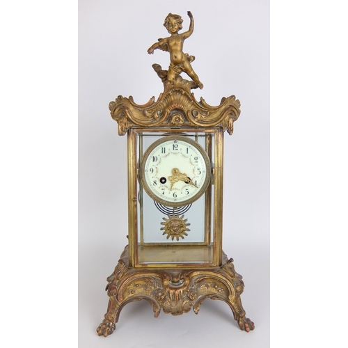 710 - A French Rococo style gilt metal mounted mantle clock