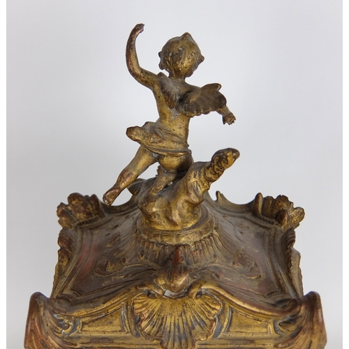 710 - A French Rococo style gilt metal mounted mantle clock