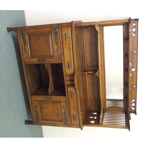 882 - An Arts and Crafts oak mirrorback sideboard