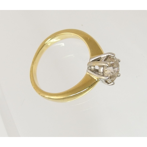 89 - An 18ct yellow and white gold solitaire diamond ring