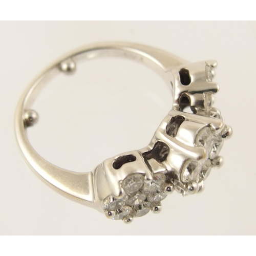 93 - An 18ct white gold diamond cluster ring