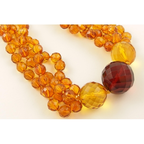 98 - Item 3. A diamond orange and cherry amber colour necklace