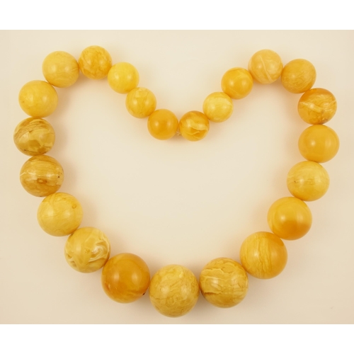 99 - Item 4. A very large royal amber coloured necklace