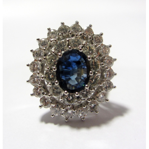 100 - An impressive sapphire and diamond cluster ring