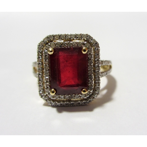 103 - A ruby and diamond cluster ring