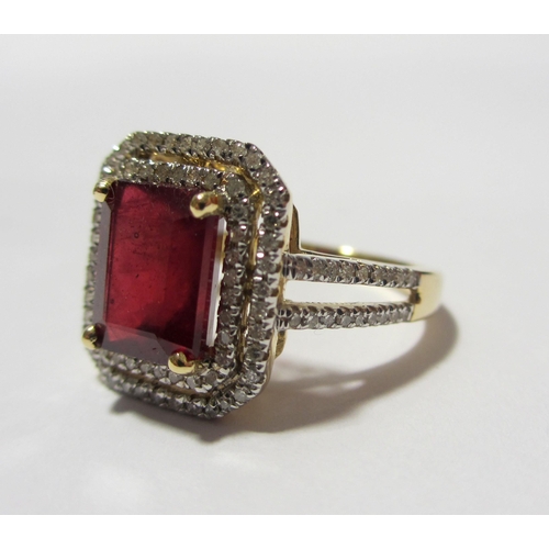 103 - A ruby and diamond cluster ring