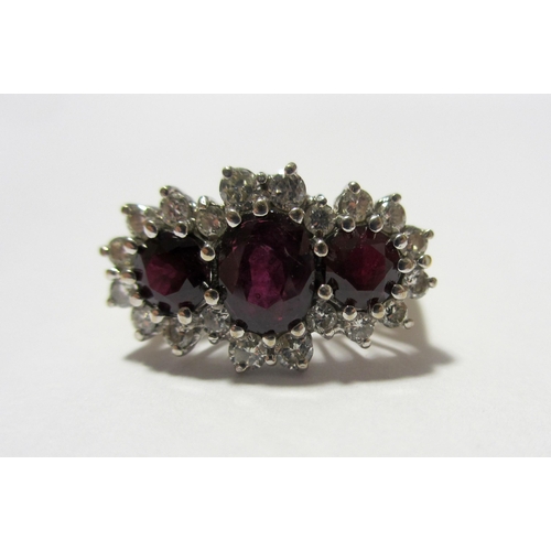 105 - A ruby and diamond cluster ring