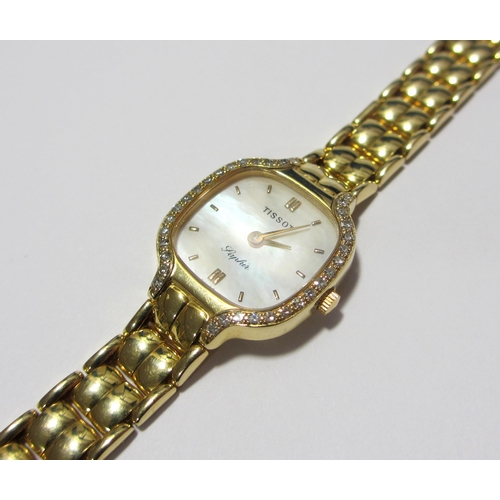 117 - A lady's gold diamond wrist watch by Tissot