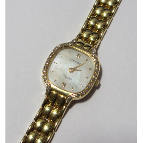 117 - A lady's gold diamond wrist watch by Tissot