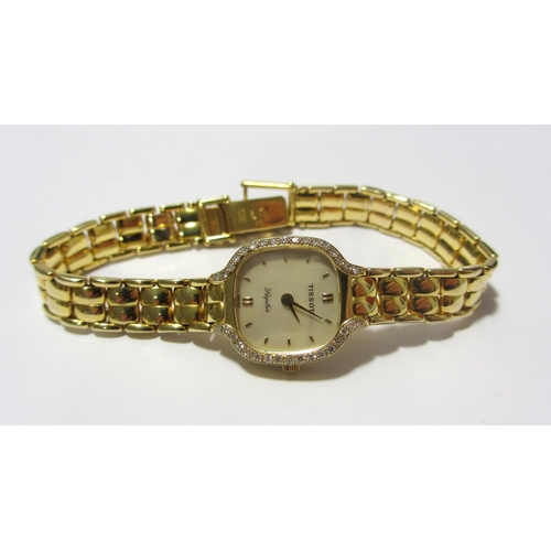 117 - A lady's gold diamond wrist watch by Tissot