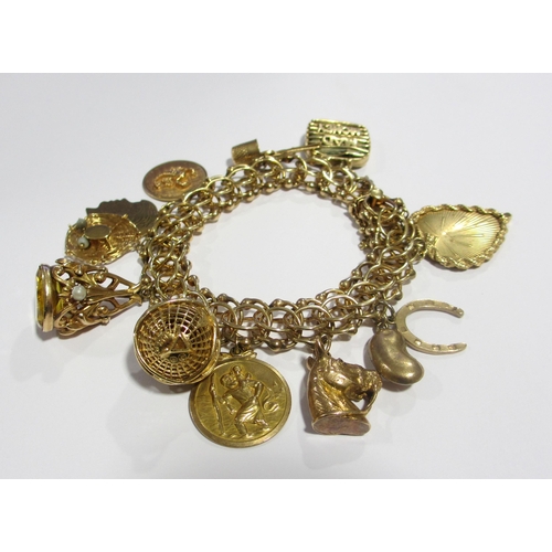 121 - A 14kt gold charm bracelet