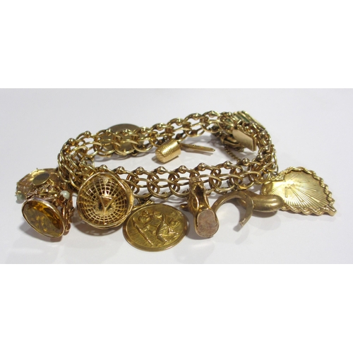 121 - A 14kt gold charm bracelet