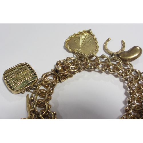 121 - A 14kt gold charm bracelet