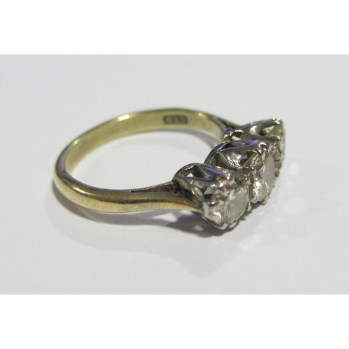 129 - A diamond three stone ring