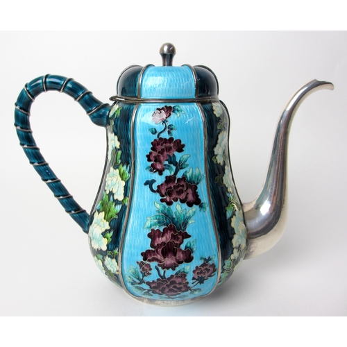 153 - An oriental white metal teapot