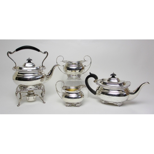 164 - A four piece silver tea service including a kettle on stand