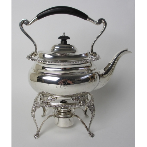 164 - A four piece silver tea service including a kettle on stand