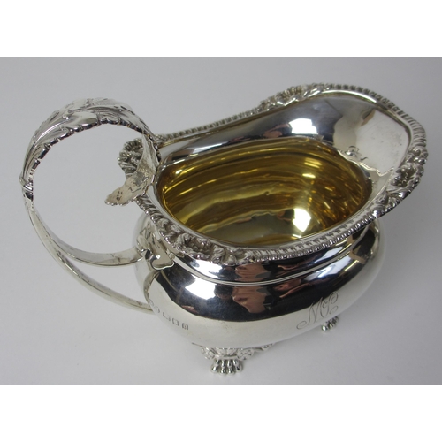 164 - A four piece silver tea service including a kettle on stand