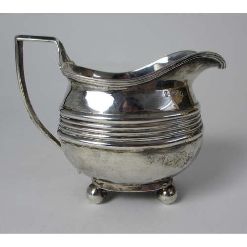 201 - A Georgian silver cream jug