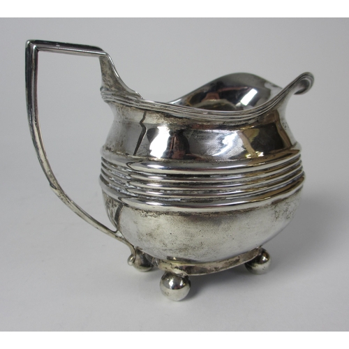 201 - A Georgian silver cream jug