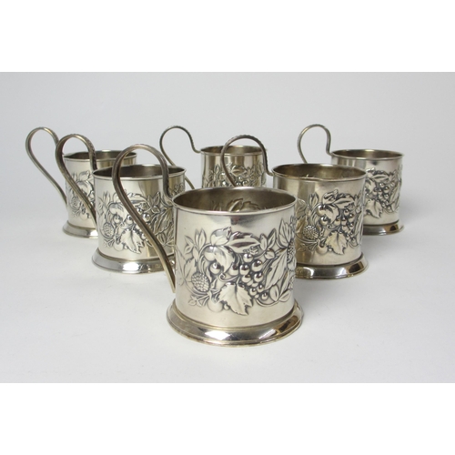 202 - A set of six white metal cup holders