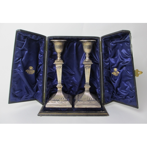 214 - A pair of Victorian silver candlesticks