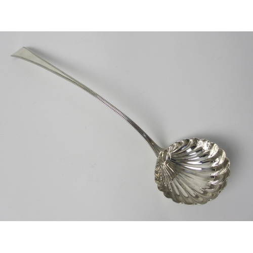 220 - A Georgian silver soup ladle